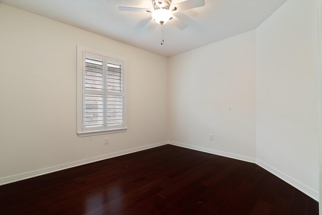 946 Shalimar Point Dr, Shalimar, FL 32579 - spare room featuring dark wood-type flooring, a ceiling fan, and baseboards