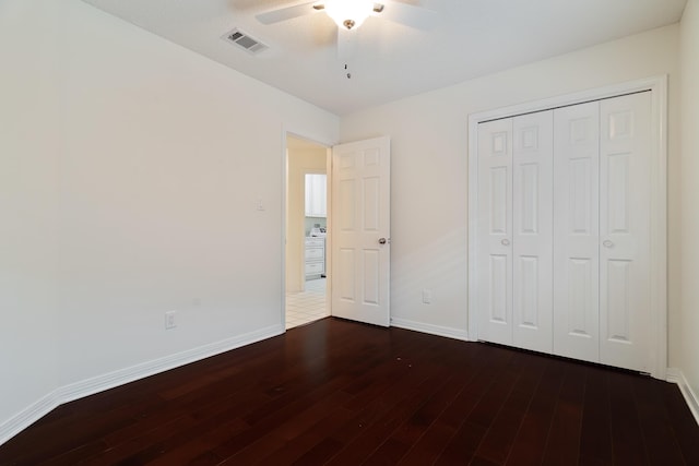 946 Shalimar Point Dr, Shalimar, FL 32579 - unfurnished bedroom featuring dark wood-style floors, baseboards, a closet, and a ceiling fan