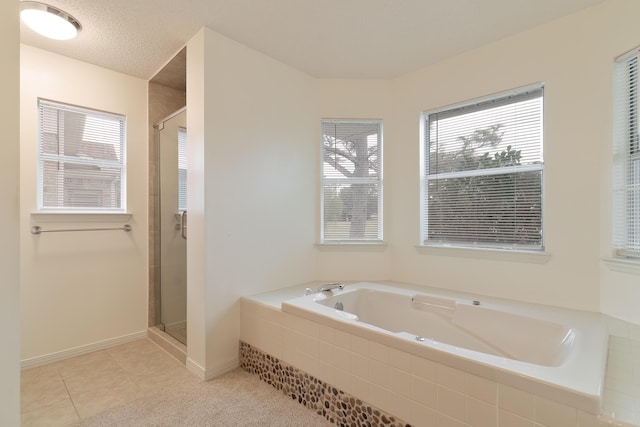 946 Shalimar Point Dr, Shalimar, FL 32579 - bathroom with a stall shower, a bath, tile patterned floors, and baseboards