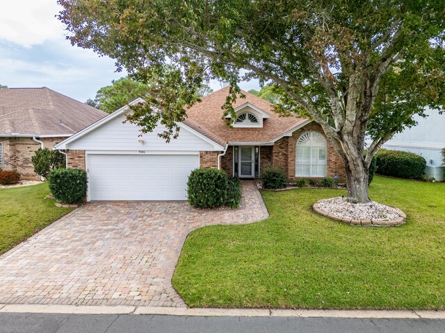 946 Shalimar Point Dr, Shalimar, FL 32579 - ranch-style house with brick siding, decorative driveway, an attached garage, a front yard, and a shingled roof