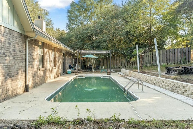 view of pool featuring a patio