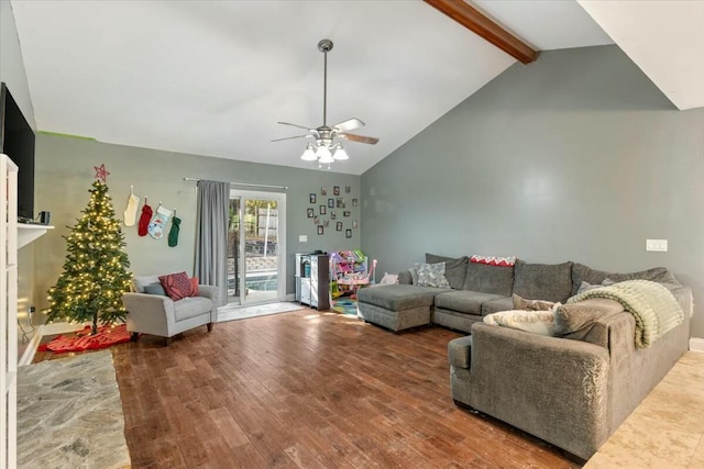 living room with hardwood / wood-style floors, high vaulted ceiling, ceiling fan, and beam ceiling