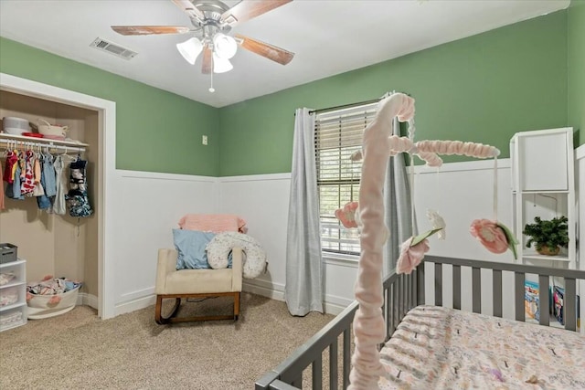 bedroom featuring ceiling fan, a closet, and carpet