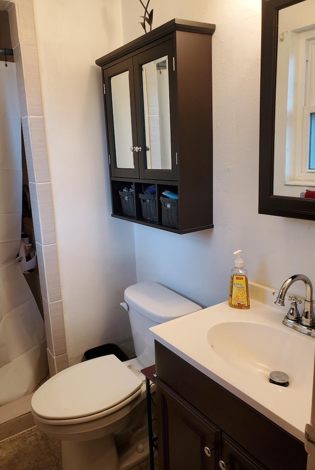 50 Junior Dr, Shalimar, FL 32579 - bathroom with toilet, vanity, and curtained shower