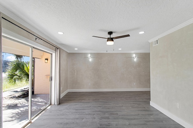 unfurnished room featuring hardwood / wood-style floors, ceiling fan, and crown molding