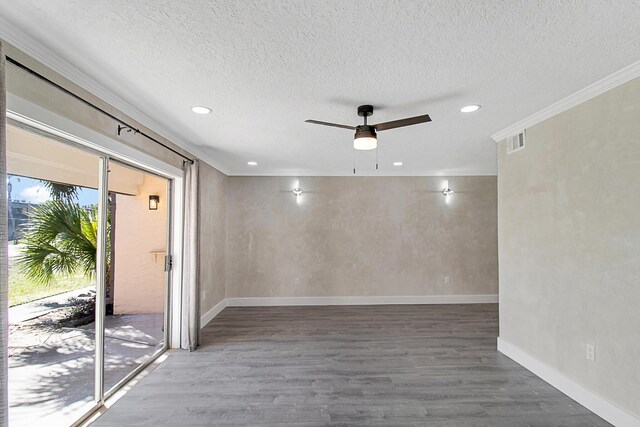 402 Marshall Ct Unit 01, Fort Walton Beach, FL 32548 - empty room featuring wood finished floors, a textured ceiling, a ceiling fan, recessed lighting, and baseboards
