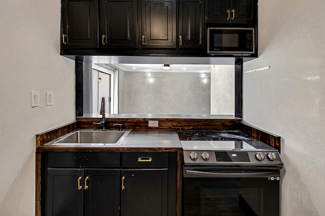 kitchen with stainless steel electric range oven and sink