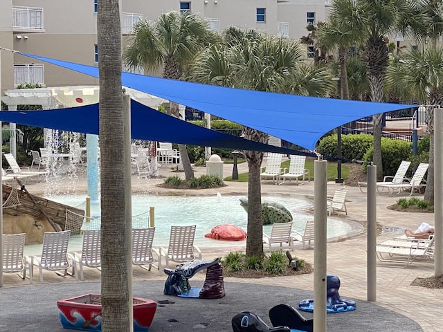 surrounding community with a swimming pool