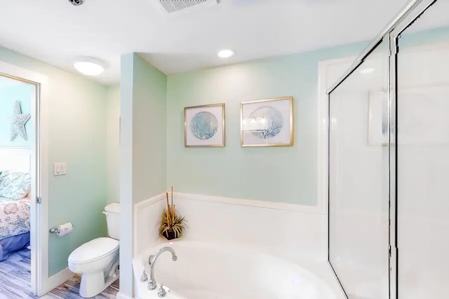 full bath with ensuite bathroom, a garden tub, toilet, and a stall shower
