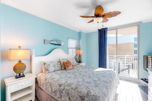 bedroom with access to exterior, wood finished floors, and ceiling fan