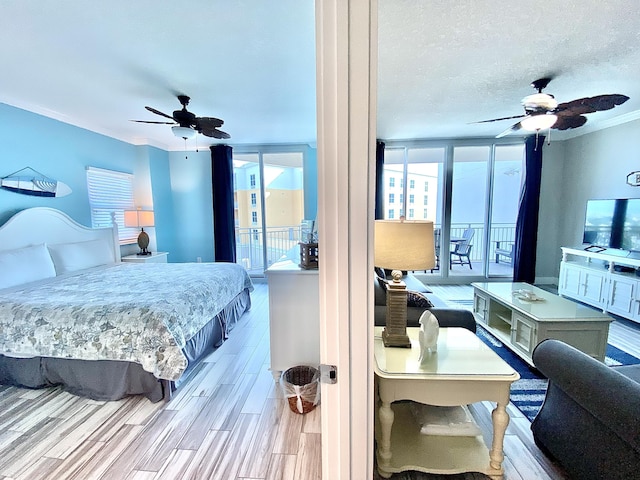 bedroom with crown molding, wood finished floors, access to outside, and ceiling fan