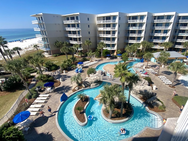 view of swimming pool with a water view