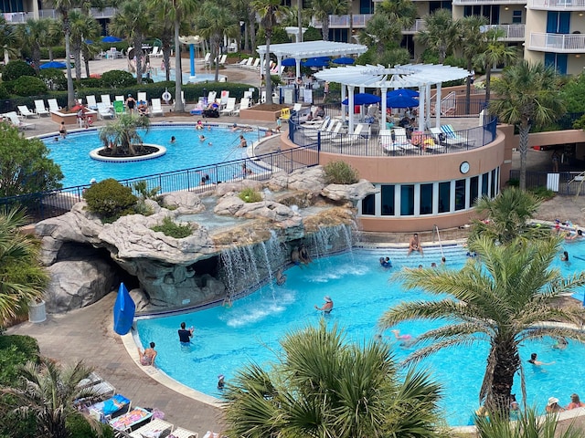 view of pool with pool water feature