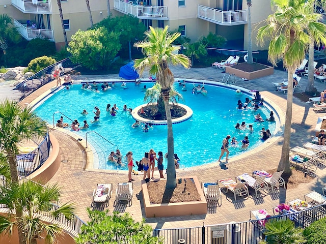 view of swimming pool featuring a patio