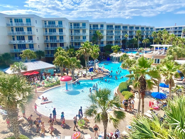 view of swimming pool with a patio and pool water feature