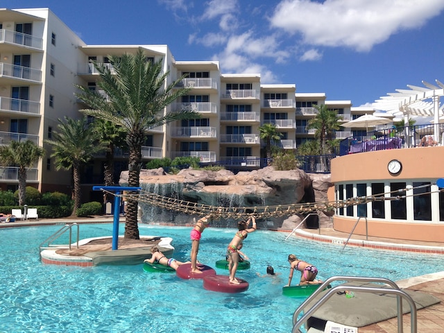 view of pool featuring pool water feature