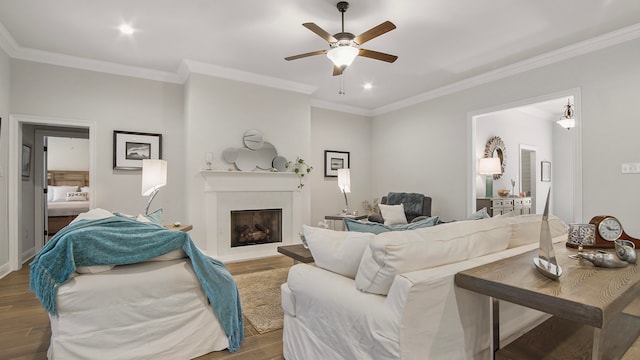 living room with light hardwood / wood-style floors and ornamental molding