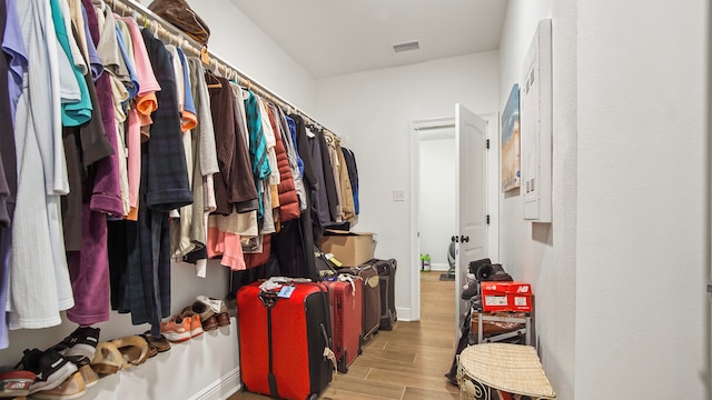 spacious closet featuring light wood-type flooring