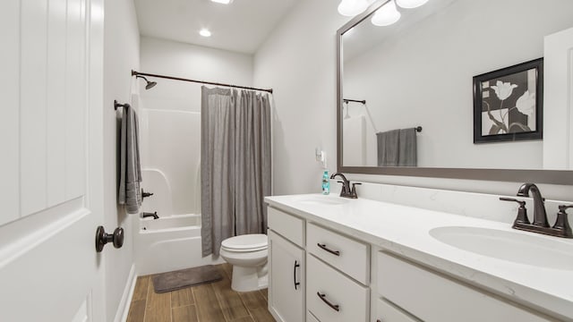 full bathroom with hardwood / wood-style floors, vanity, toilet, and shower / bathtub combination with curtain