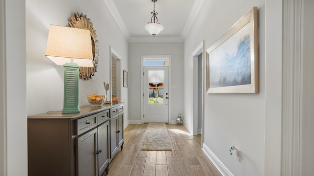 doorway to outside featuring light wood-type flooring and crown molding