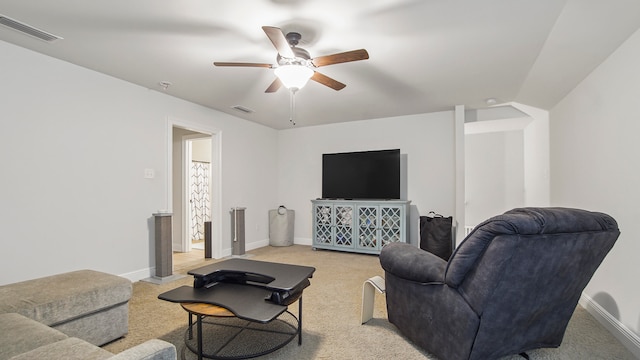 living room featuring ceiling fan and light colored carpet