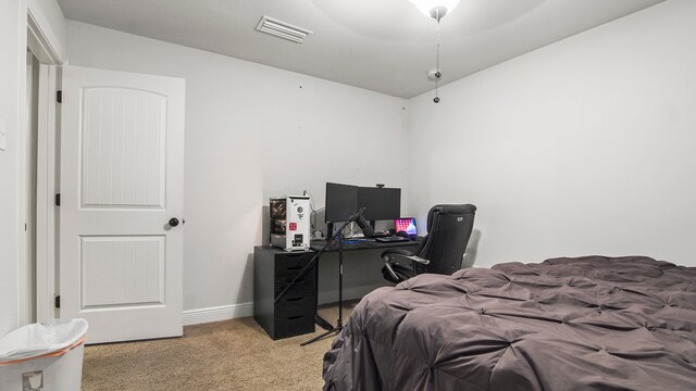 bedroom with ceiling fan and light colored carpet