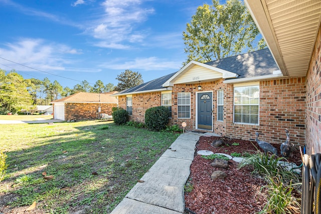 view of front facade featuring a garage and a front yard