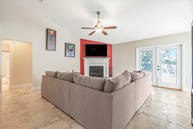 living room featuring ceiling fan and lofted ceiling