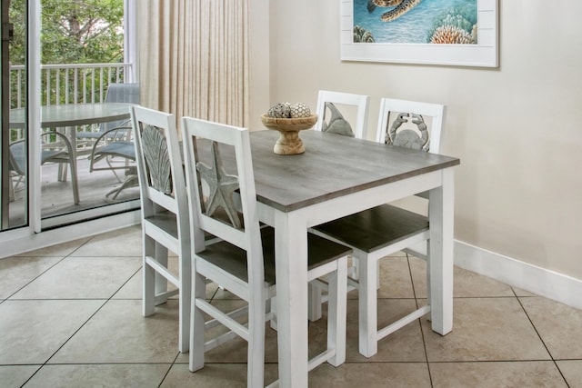 dining space featuring tile patterned floors