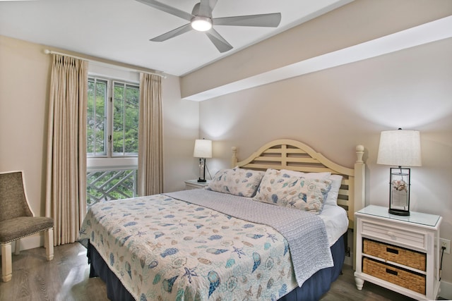 bedroom featuring dark wood-type flooring and ceiling fan