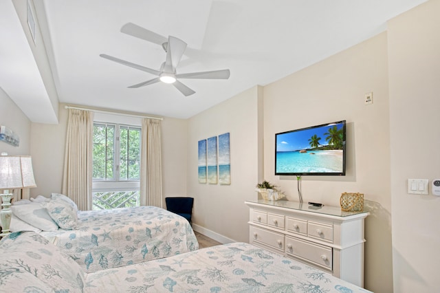 bedroom with hardwood / wood-style floors and ceiling fan