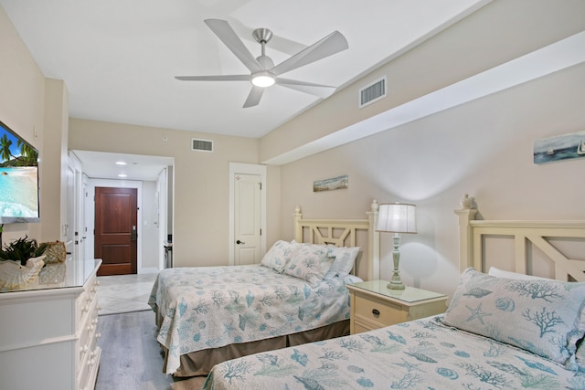 bedroom featuring light hardwood / wood-style floors and ceiling fan