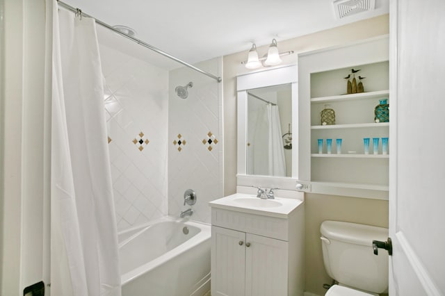 full bathroom featuring vanity, shower / bath combo with shower curtain, and toilet