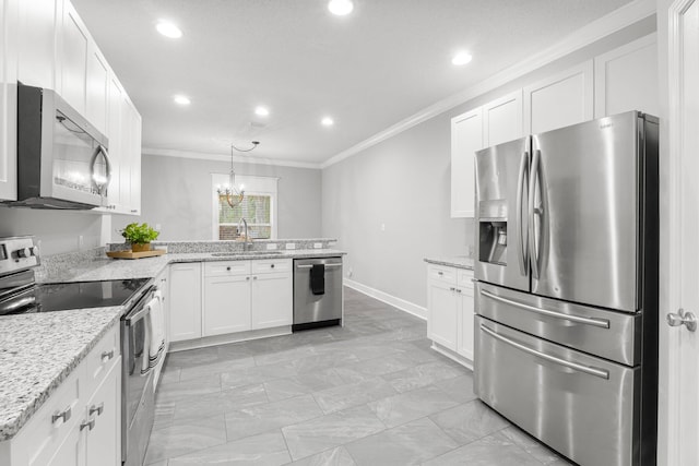 kitchen with white cabinets, appliances with stainless steel finishes, ornamental molding, and sink