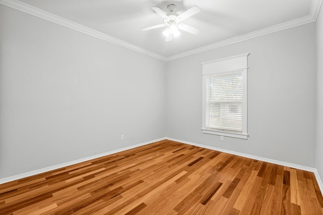 unfurnished room with hardwood / wood-style floors, ceiling fan, and ornamental molding