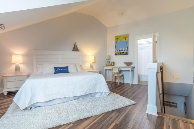 bedroom with dark hardwood / wood-style flooring and vaulted ceiling