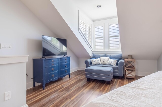 bedroom featuring dark wood-type flooring and vaulted ceiling