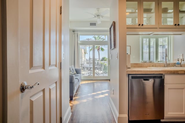 doorway featuring hardwood / wood-style flooring, plenty of natural light, and ceiling fan