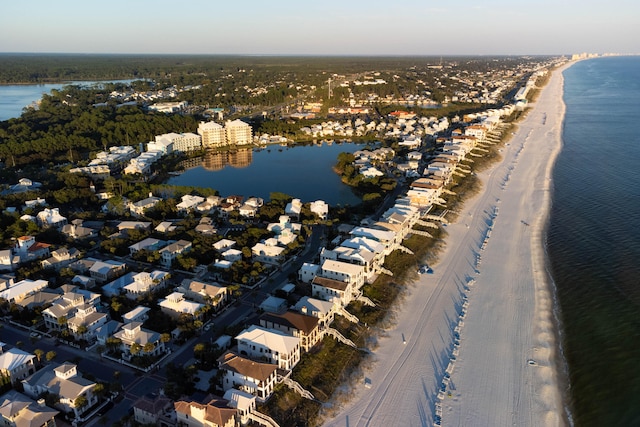 aerial view with a water view and a view of the beach