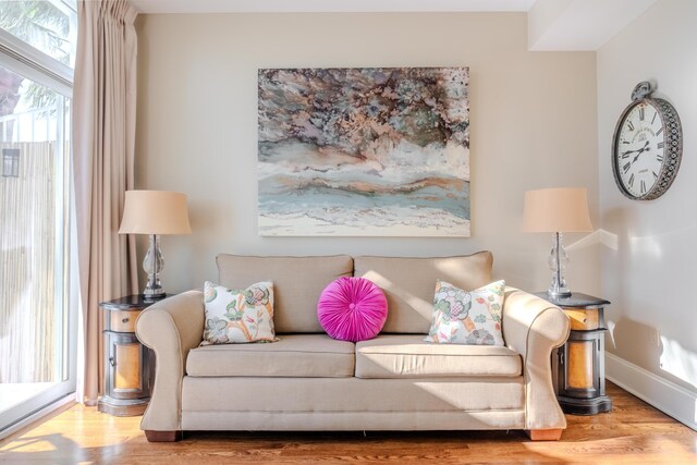 105 Carillon Market St Ste 302, Panama City Beach, FL 32413 - living room featuring wood finished floors and baseboards