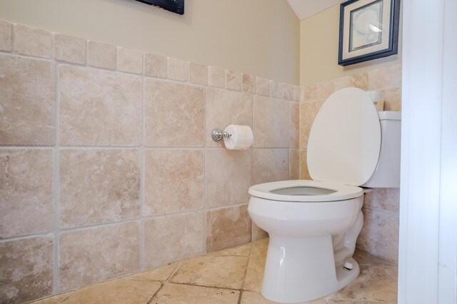 105 Carillon Market St Ste 302, Panama City Beach, FL 32413 - bathroom featuring tile walls and toilet