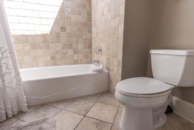 bathroom with toilet and shower / tub combo