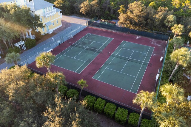 105 Carillon Market St Ste 302, Panama City Beach, FL 32413 - view of tennis court with a wooded view