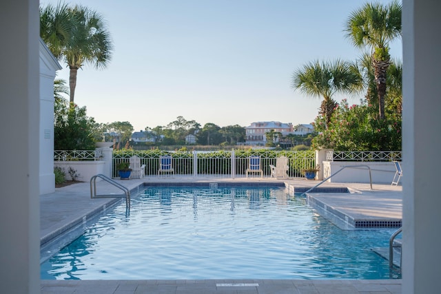 view of swimming pool with a patio