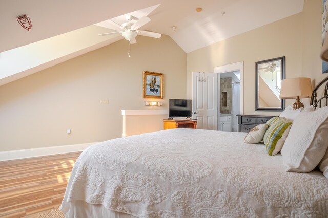 105 Carillon Market St Ste 302, Panama City Beach, FL 32413 - bedroom featuring wood finished floors, baseboards, lofted ceiling, and a ceiling fan