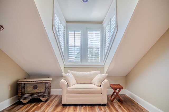 105 Carillon Market St Ste 302, Panama City Beach, FL 32413 - sitting room with healthy amount of natural light, wood finished floors, and baseboards