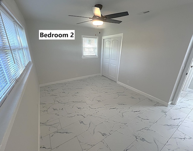 empty room featuring ceiling fan