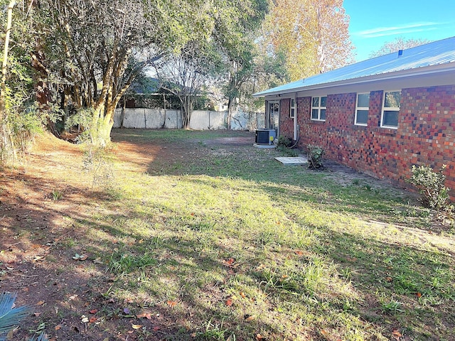 view of yard featuring central air condition unit