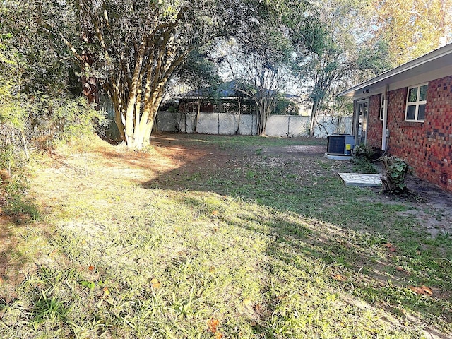 view of yard with central AC unit