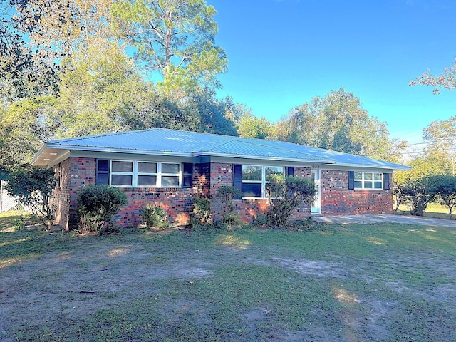 ranch-style house with a front lawn